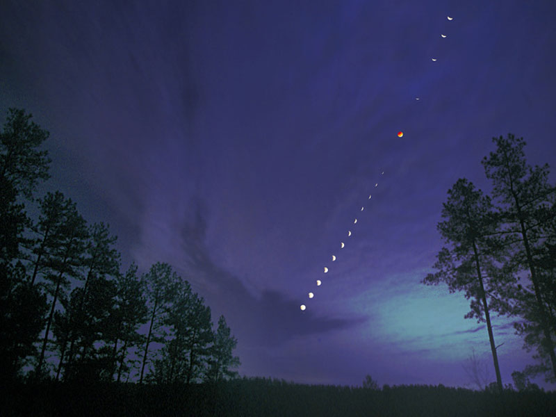 A total lunar eclipse shown in a time lapse image captured in 2003 over North Carolina, USA