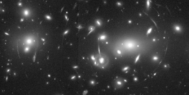 Abell 2218: Un cúmulo de galaxias y una lente